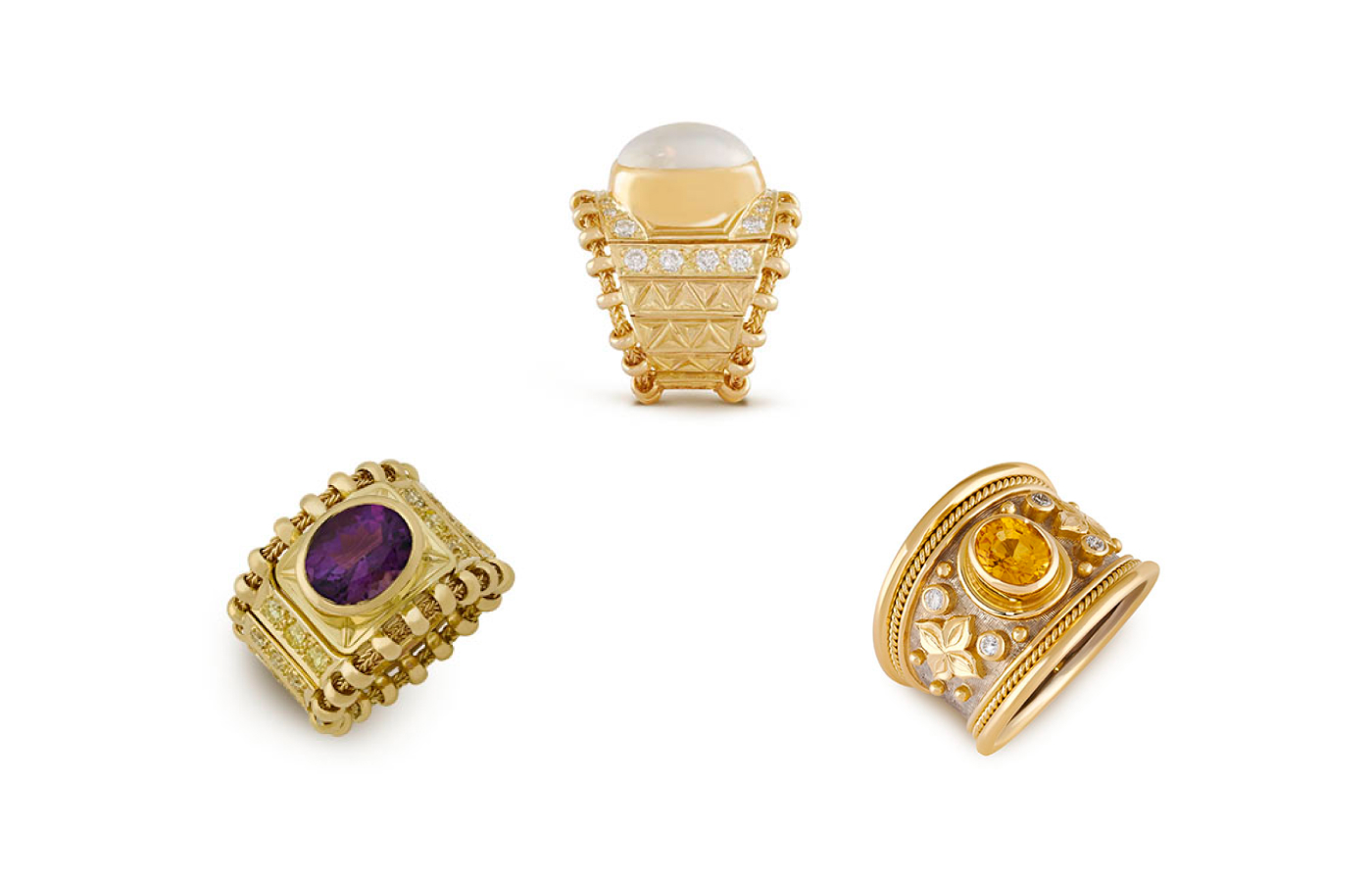  A trio of rings by Elizabeth Gage including (from L-R) the amethyst and yellow diamond Agincourt ring, the Mabé pearl Agincourt ring, and the yellow sapphire Tapered Templar ring