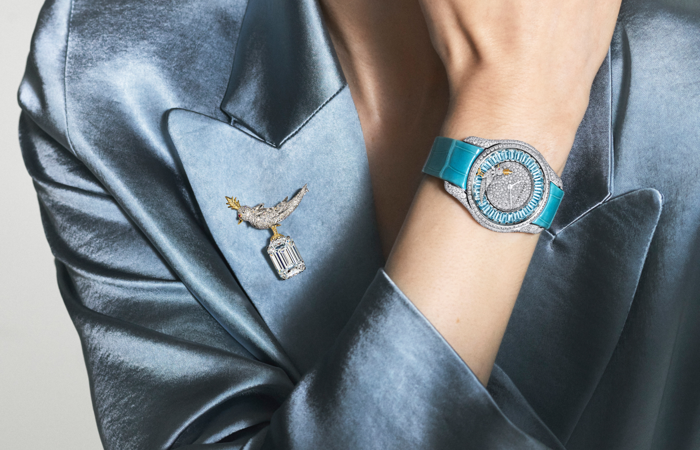 Model wearing Tiffany & Co. Bird on a Rock watch in white gold, platinum, aquamarine and diamond