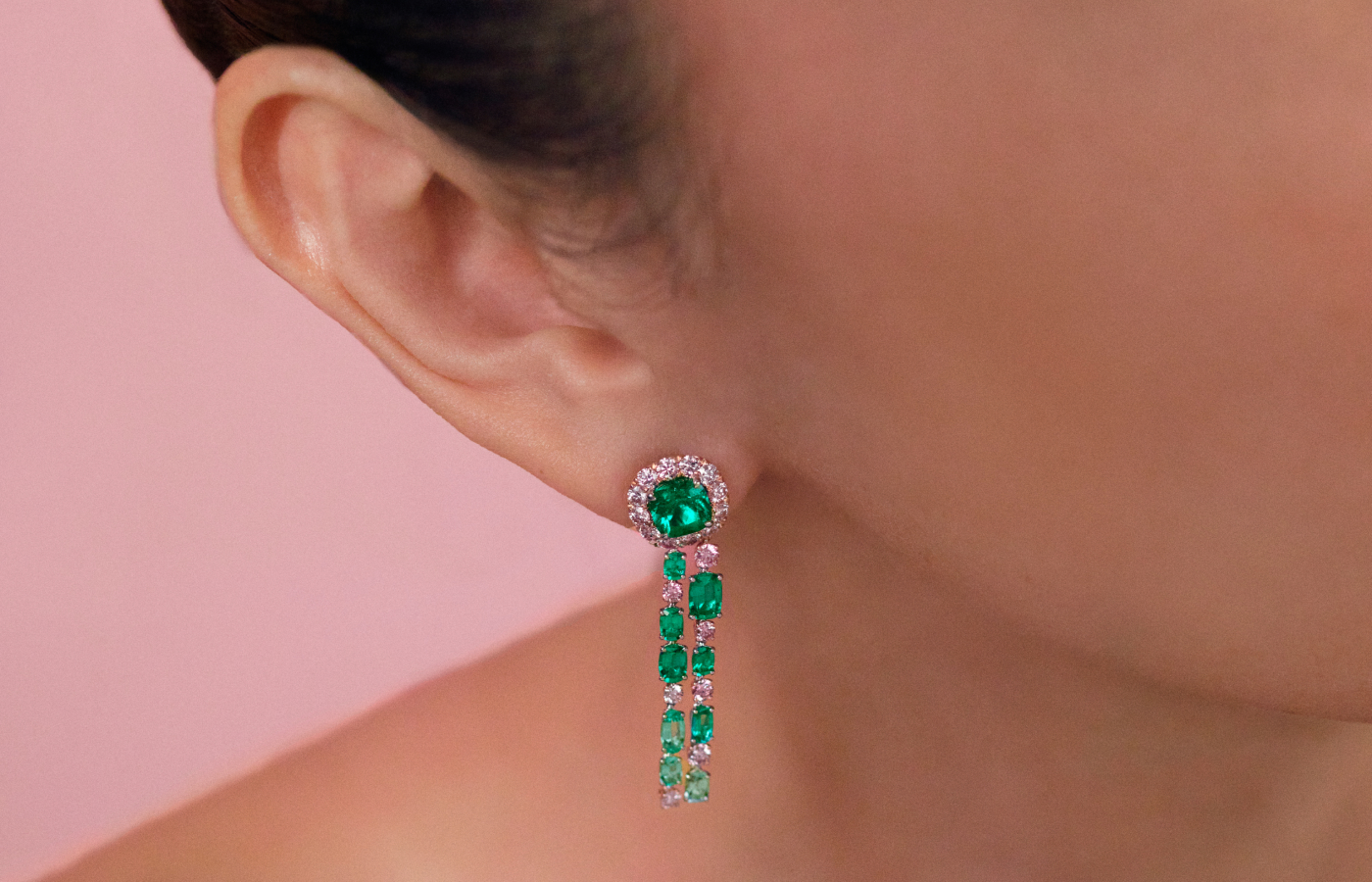  Model wearing Muzo Emerald Colombia Ella earrings in gold, platinum, Muzo Emeralds,  Argyle pink diamonds and white diamonds from the Green Jewel Tradition collection