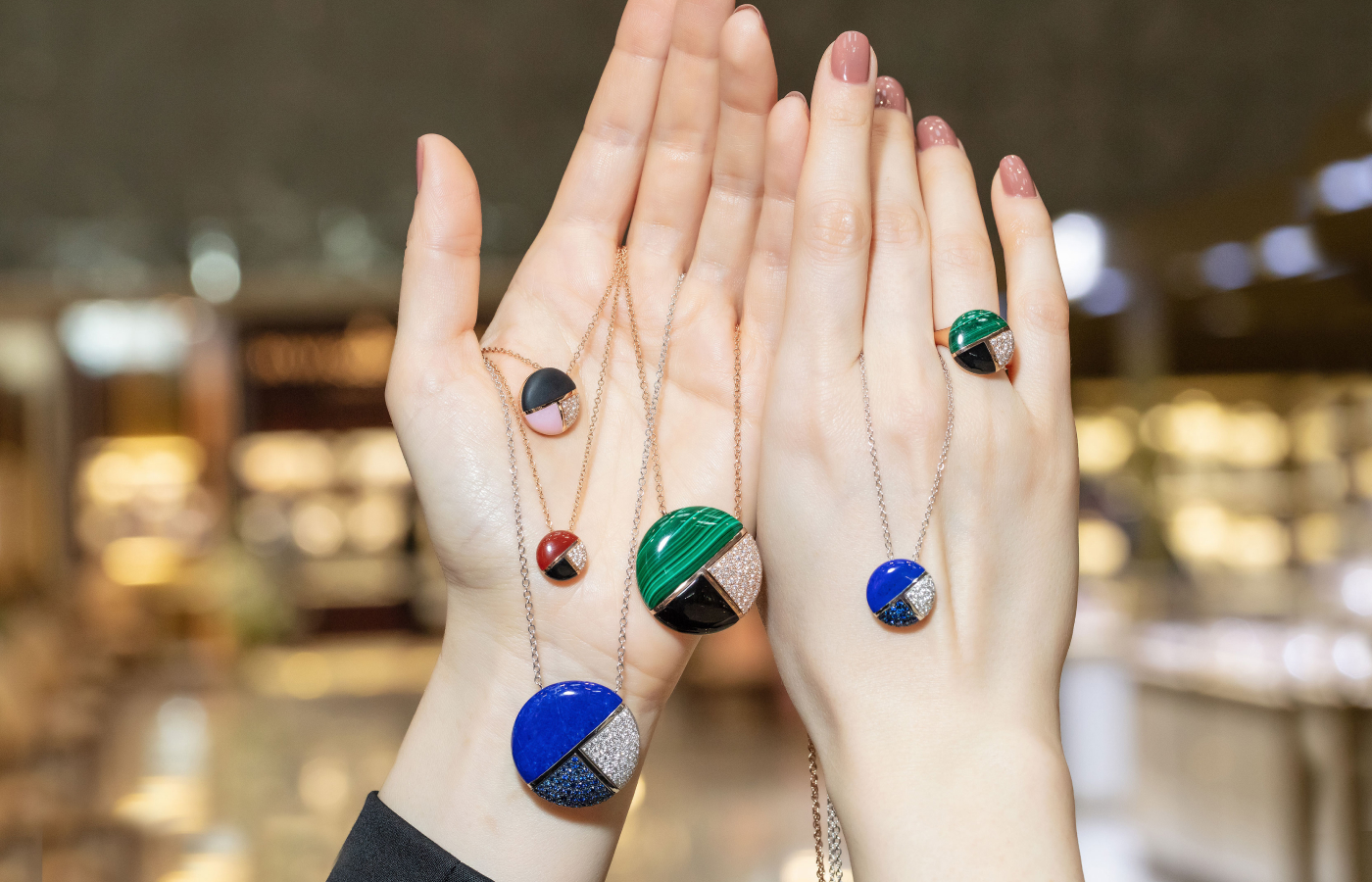  Luca Carati Twenties collection pendants with malachite, lapis lazuli, carnelian, onyx, pink opal, sapphires, diamonds. Photo by Simon Martner