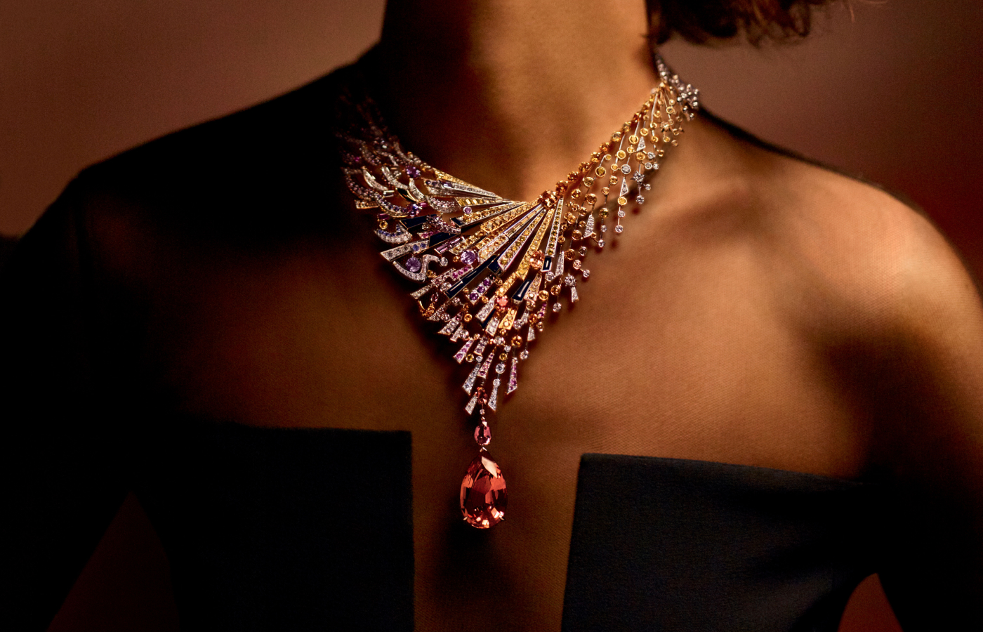 Model wearing Chaumet Lueurs d’Orage high jewellery necklace featuring a 37.68-ct Imperial topaz , multicloured sapphires and diamonds from the Les Ciels de Chaumet collection