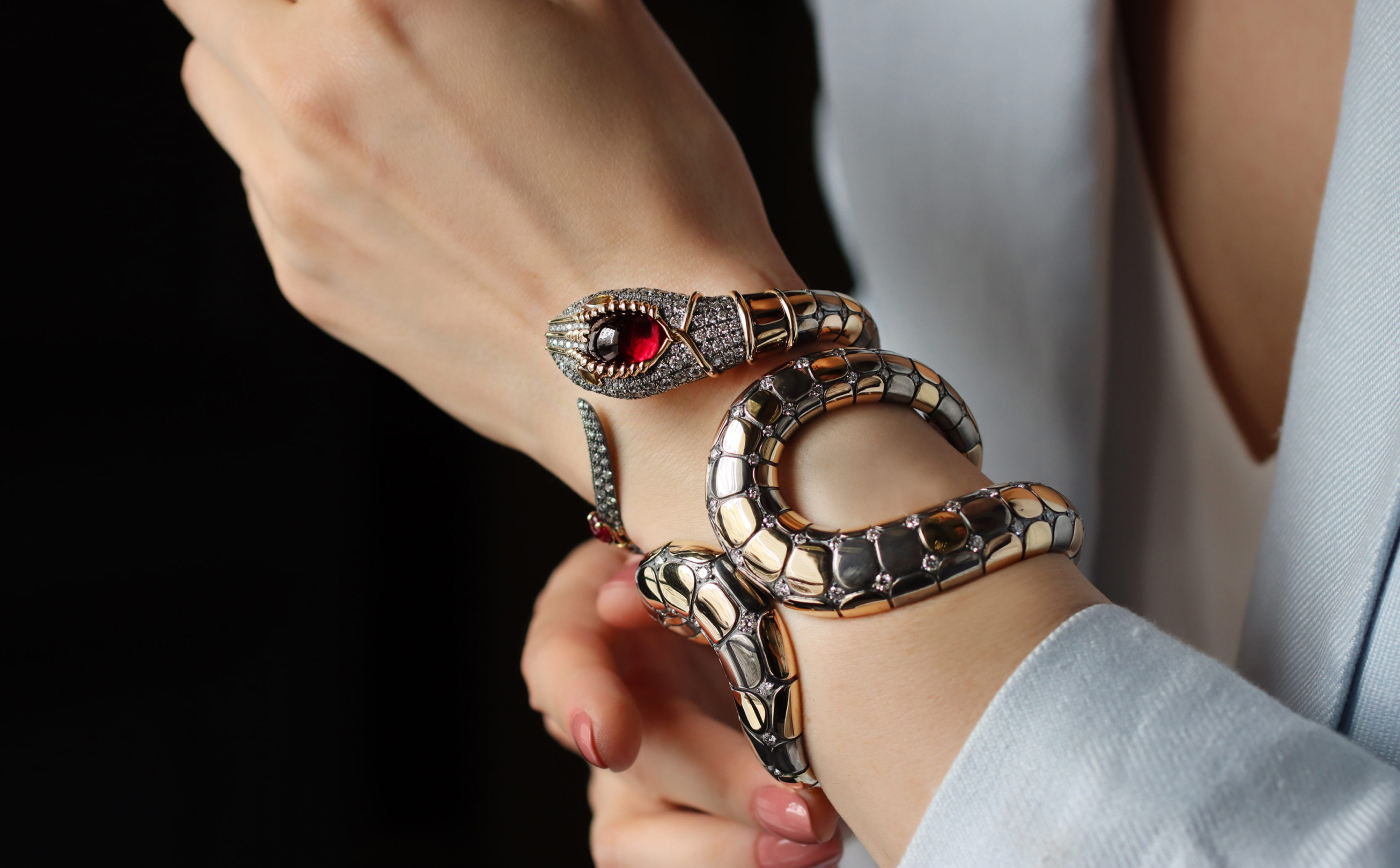  Snake cuff bracelet with a cabochon rubellite in yellow gold and silver from Magica Naturae collection by Elie Top