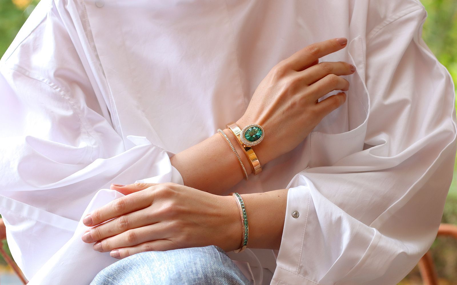 Katerina Perez wears a Jochen Leën Paraiba tourmaline and diamond bangle set in rose gold