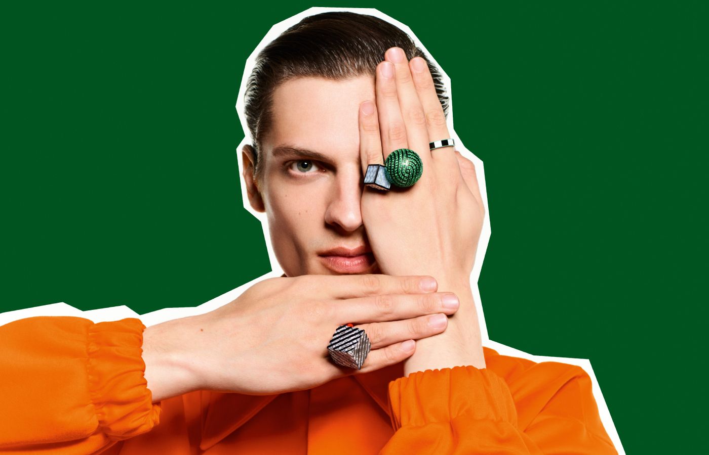  A model wears Boucheron This Is Not A Ring creations, including a two-finger ring with mother of pearl, tsavorites and lacquer in resin and titanium, from the More is More High Jewellery collection