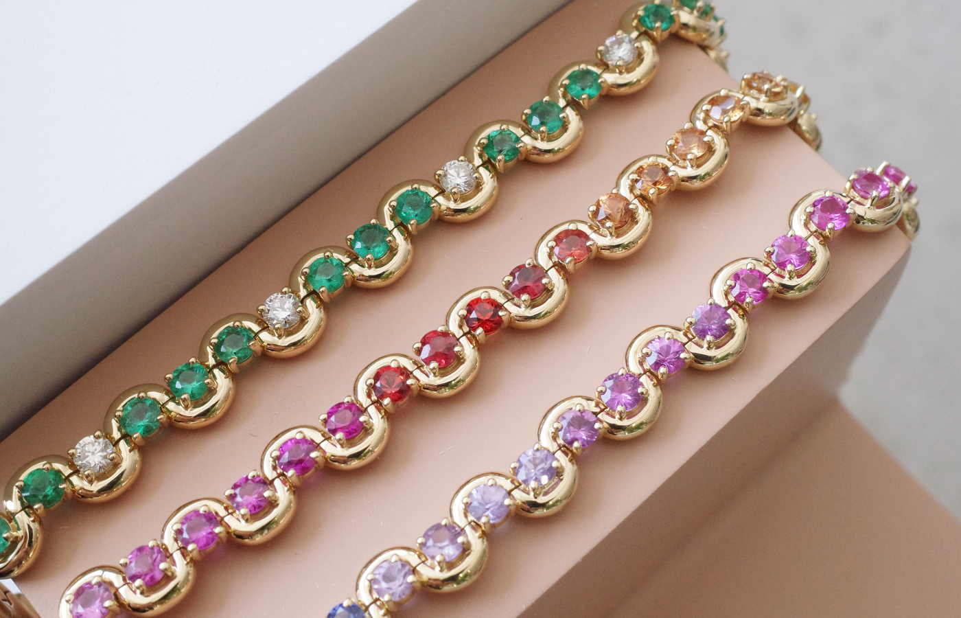 State Property Arcane Edessa tennis bracelets in gold, emerald and sapphire