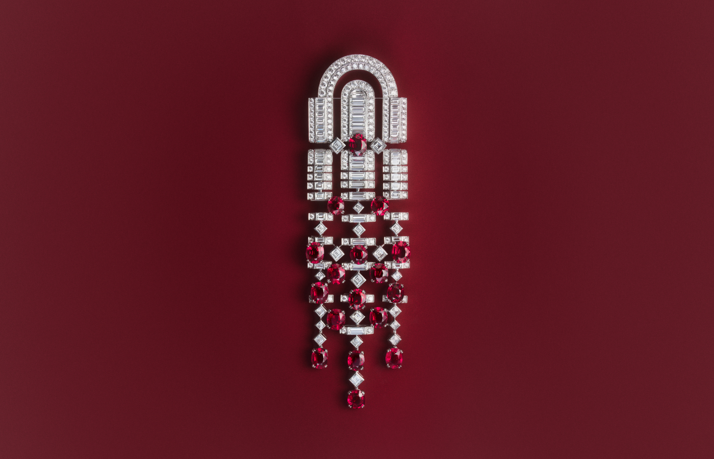 Rolling Red brooch with 17 oval rubies from Mozambique for a total weight of 18.82 carats, paved with diamonds in 18k white gold from the Boucheron Like a Queen High Jewellery Collection