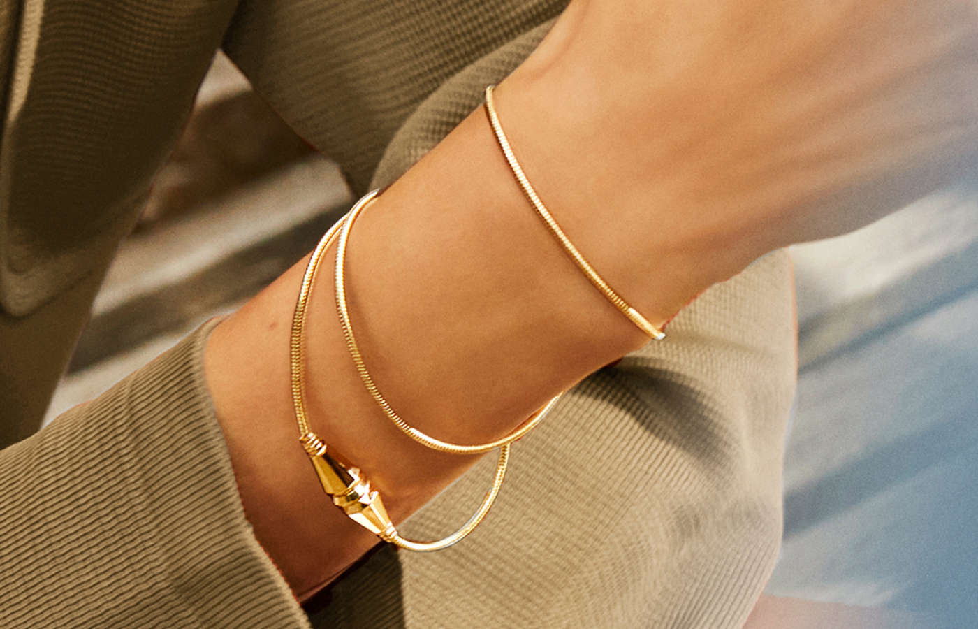Model wearing Jack de Boucheron bracelet in gold