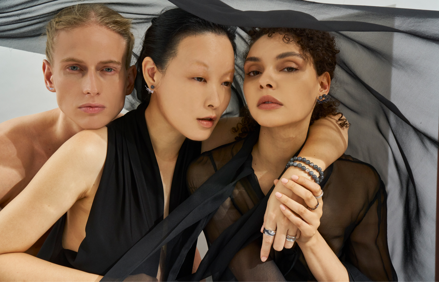 Models wearing Simone Jewels Simone X Tomo pieces in gold, black jade, black spinel and diamond