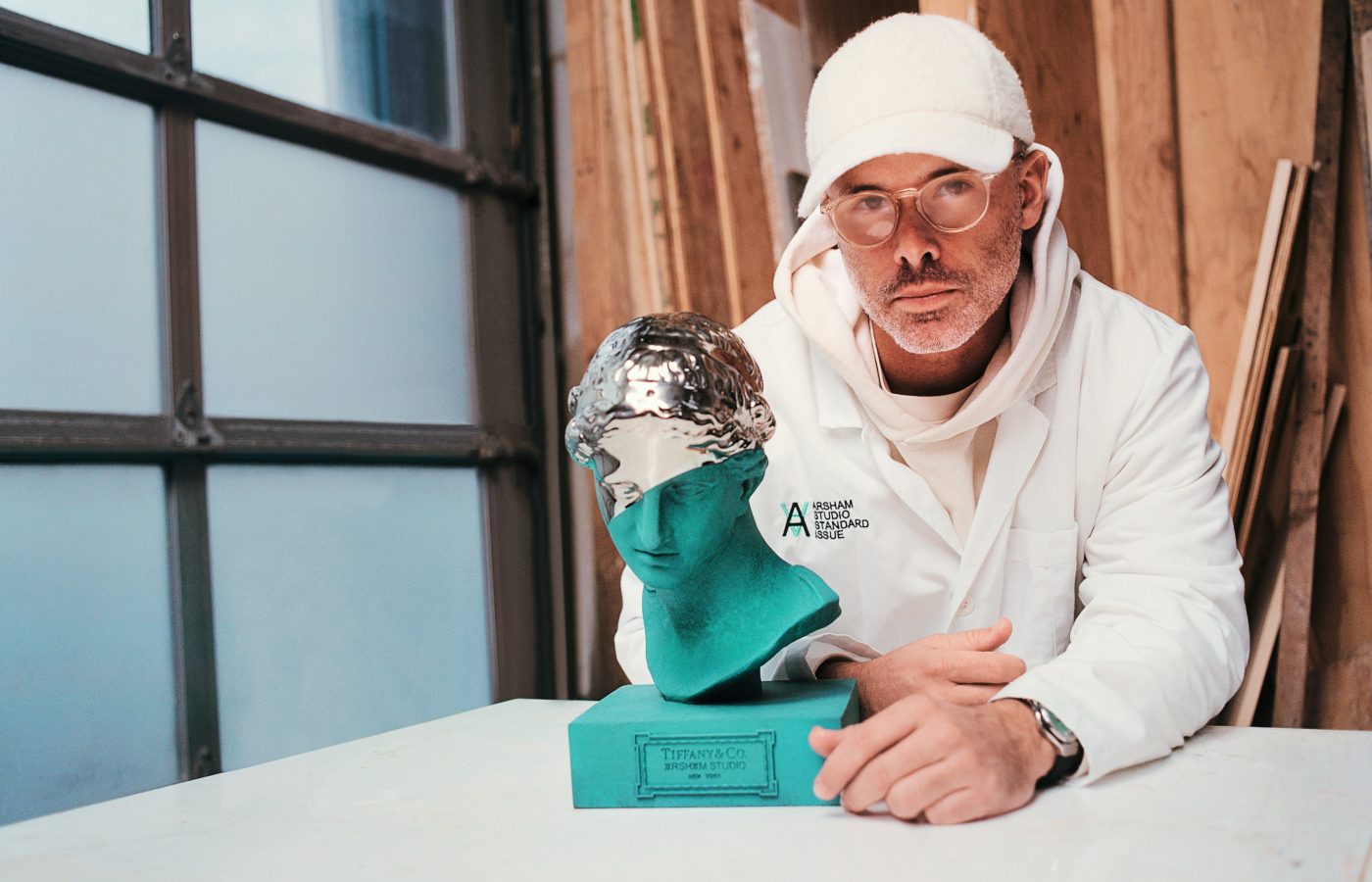  Artist Daniel Arsham posing alongside his Limited Edition Sculpture for Tiffany & Co. 