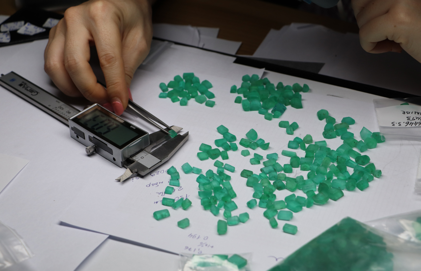  The Tsarina Jewels team sorting rough Russian emeralds by size