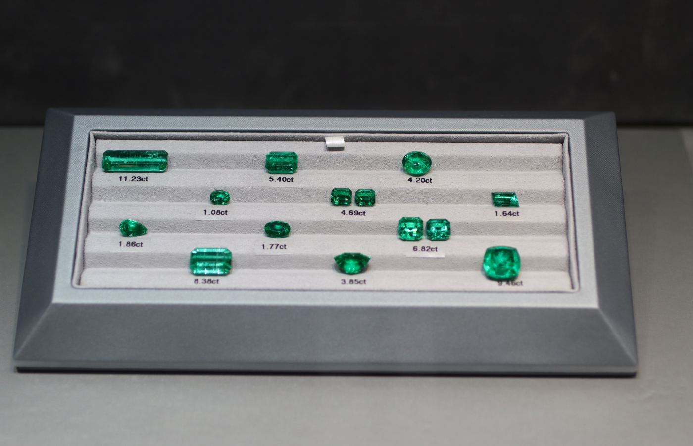  A selection of Tsarina Jewels' Russian emeralds, including a rectangular-shaped 11.23 carat gem (top left)