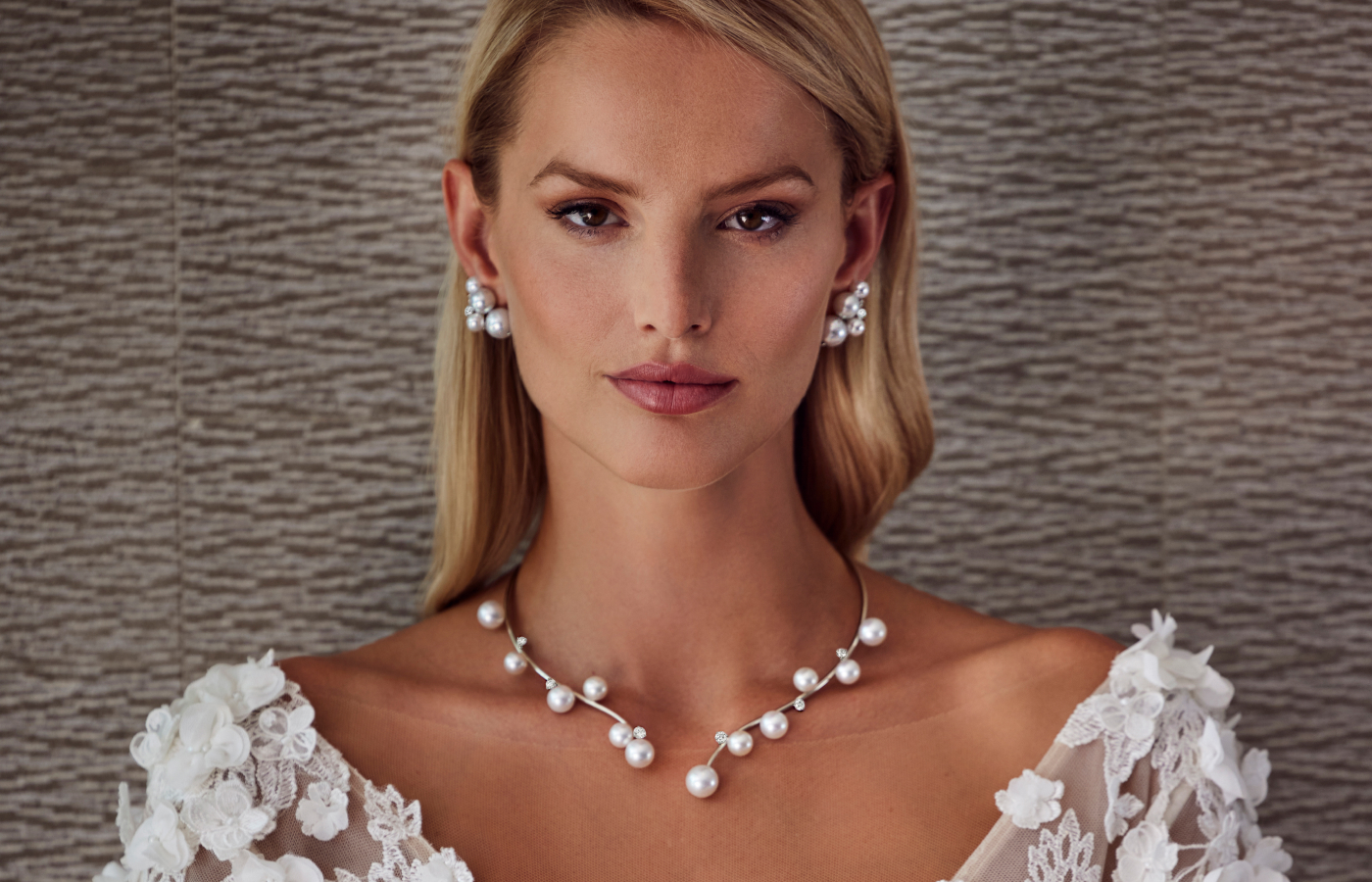  A model wears the Assael Floating Open Bubble necklace with 12 round South Sea cultured pearls and six diamonds weighing 1.33 carats, set in platinum and 18k white gold 
