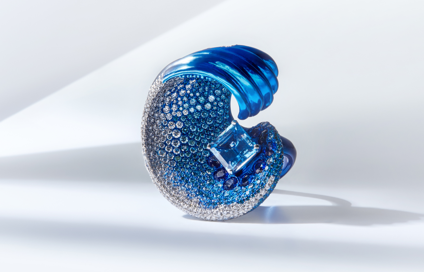  Faith Jewels Wave ring with a 4-carat Asscher-cut Santa Maria blue aquamarine, 459 blue diamonds, 465 white diamonds and 10 royal blue sapphires all set in ombre blue titanium