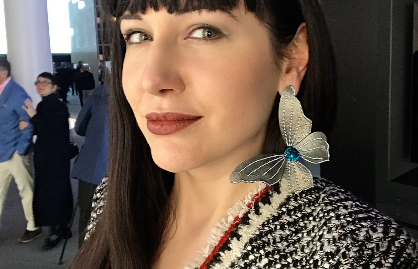 Katerina Perez tries the solo butterfly earring with blue zircon and diamonds in titanium for the first time at Baselworld 