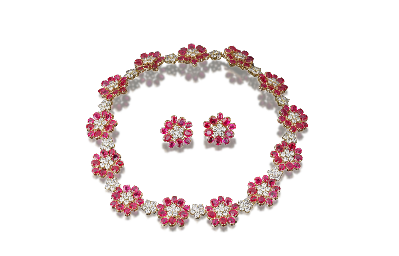  A floral-inspired Veschetti necklace and earring set with rubies and diamonds in gold