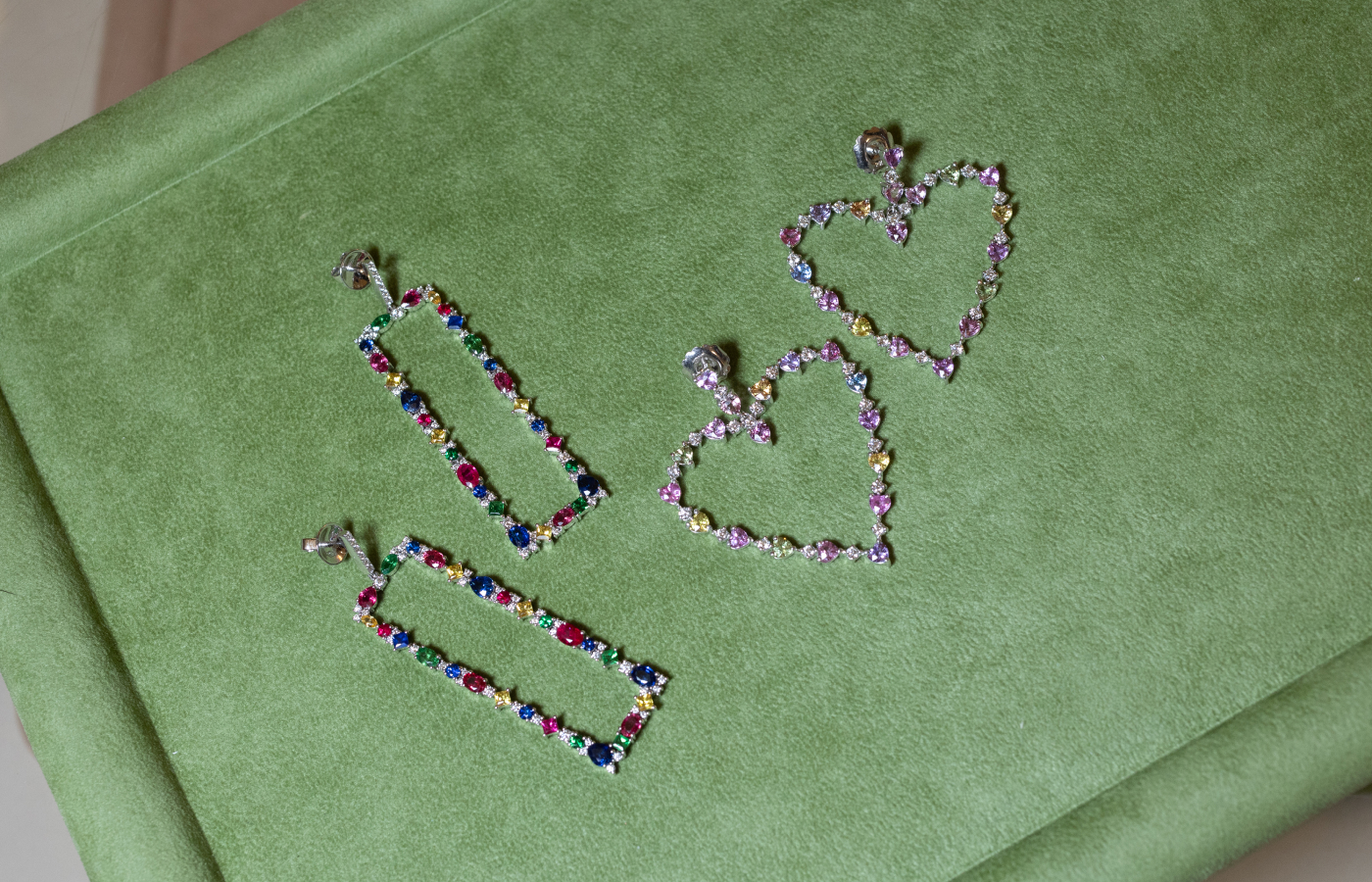  ZARIG creations include the Astor earrings (left) and the multi-gemstone heart-shaped earrings