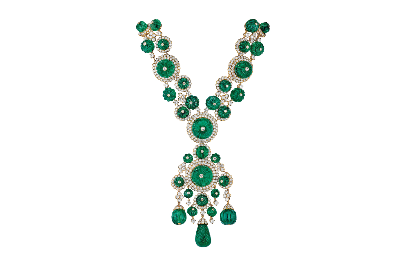  The emerald and diamond necklace and bracelet set—commissioned by Prince Karim Aga Khan IV for his wife in 1971—boasts yellow gold, diamonds, and 477.58 carats of stunning Colombian emeralds. This intricate set can be transformed from a luxurious tiered necklace into a pair of matching bracelets and a stylish pendant-clip. Photo: Van Cleef & Arpels