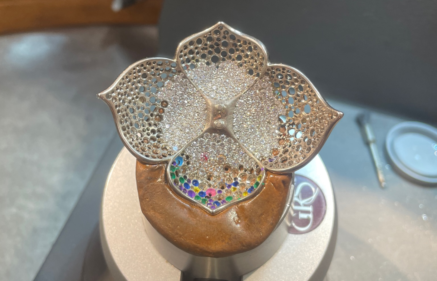  The meticulous process of setting colourless diamonds in the Lotus Flower brooch-pendant element of the Iluka necklace by Matthew Ely 