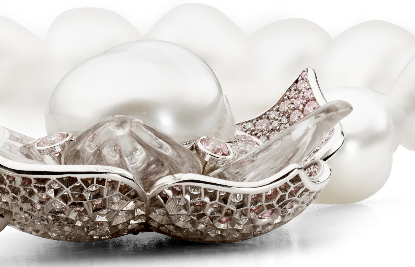  A closer look at the carved rock crystal petals that magnify the Argyle pink diamonds beneath in the Iluka necklace by Matthew Ely 