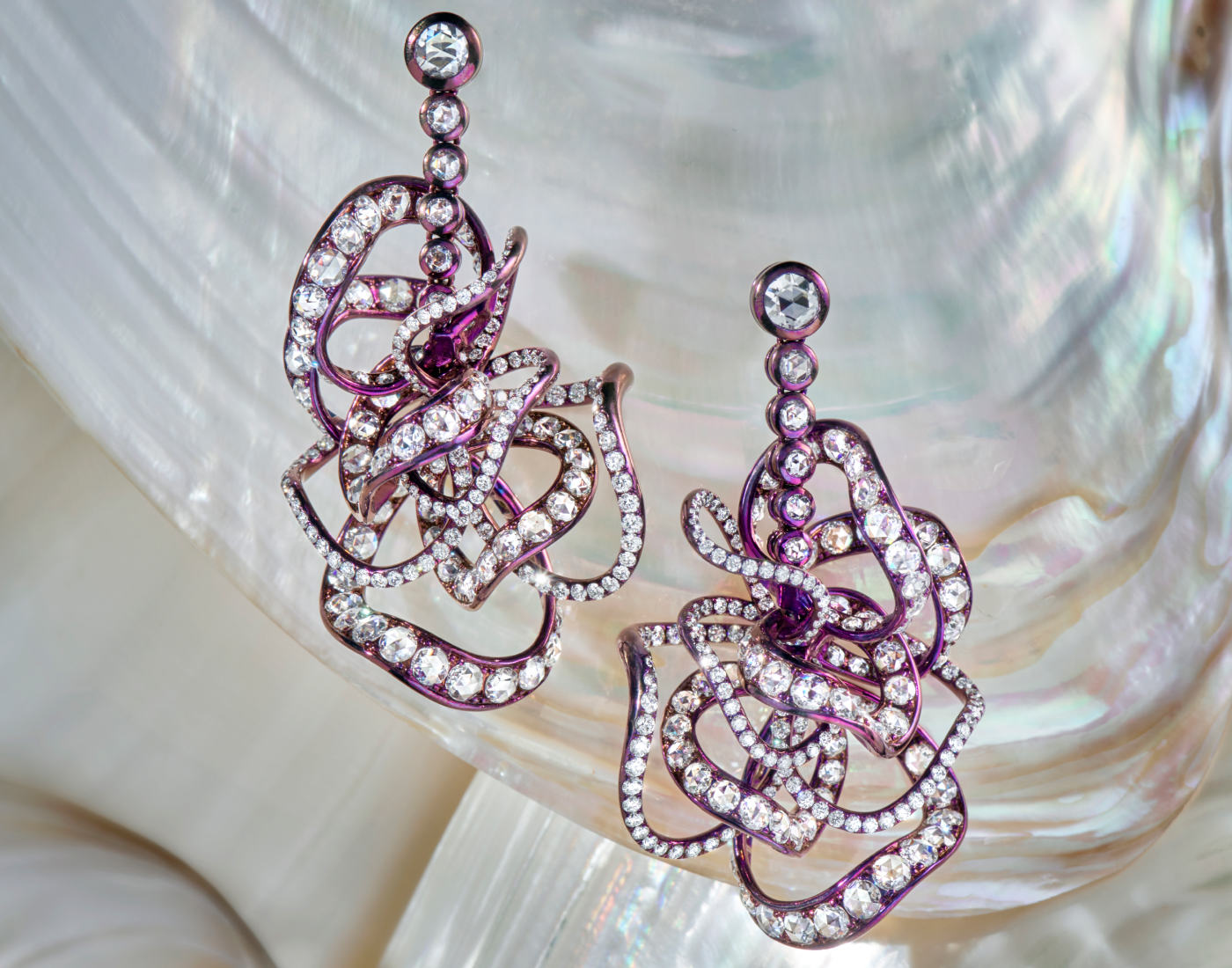  Neha Dani Akiko earrings featuring intertwined ribbons of titanium set with 12.38 carats of diamonds with a purple anodised finish