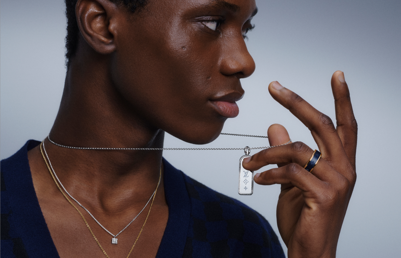  Model wearing a selection of Louis Vuitton Fine Jewellery pieces in gold, white gold and titanium from Les Gastons Vuitton collection
