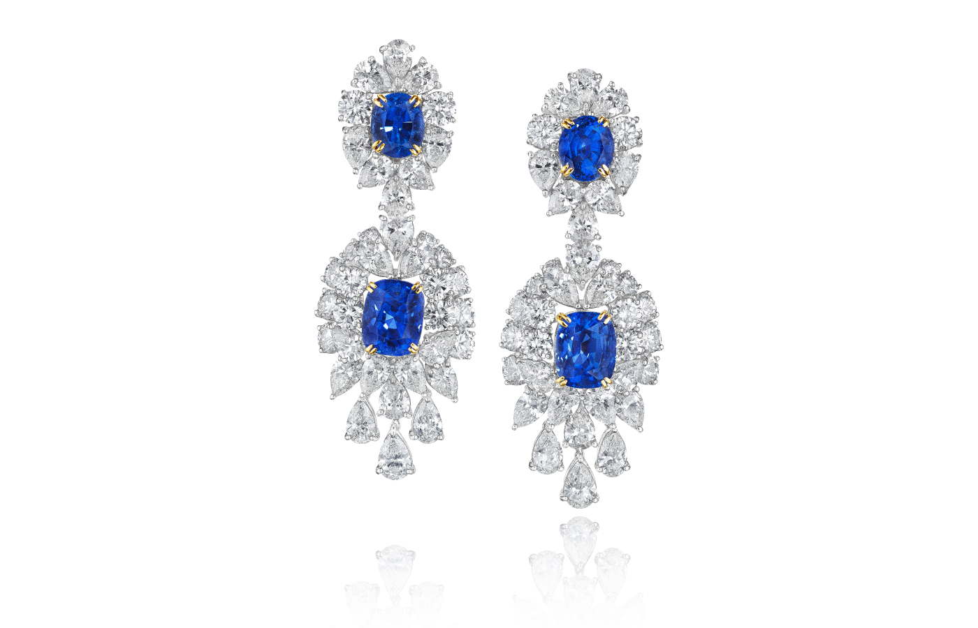  House of GOL pendant earrings with blue sapphires set with yellow gold claws, surrounded by fancy-cut colourless diamonds and pear-shaped diamond drops 
