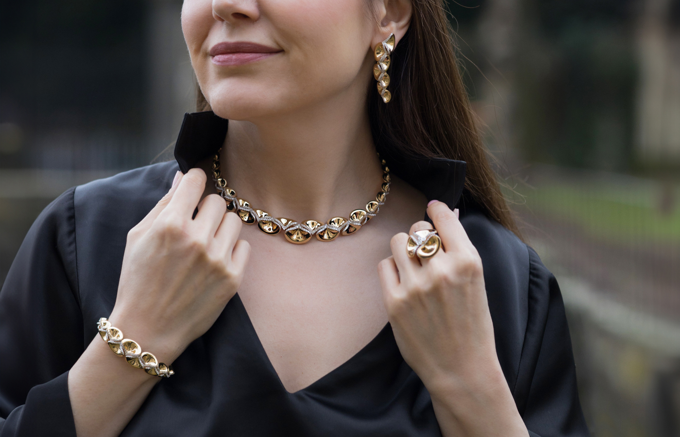 Katerina Perez wears a diamond-set 18k yellow gold necklace, bracelet, ring and earrings from the FerriFirenze Ninfea collection, which is new for 2024