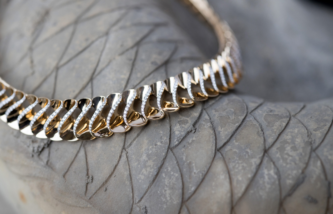  Beautiful, curved surfaces of 18k yellow gold are set with diamonds in the FerriFirenze Elica collection necklace 