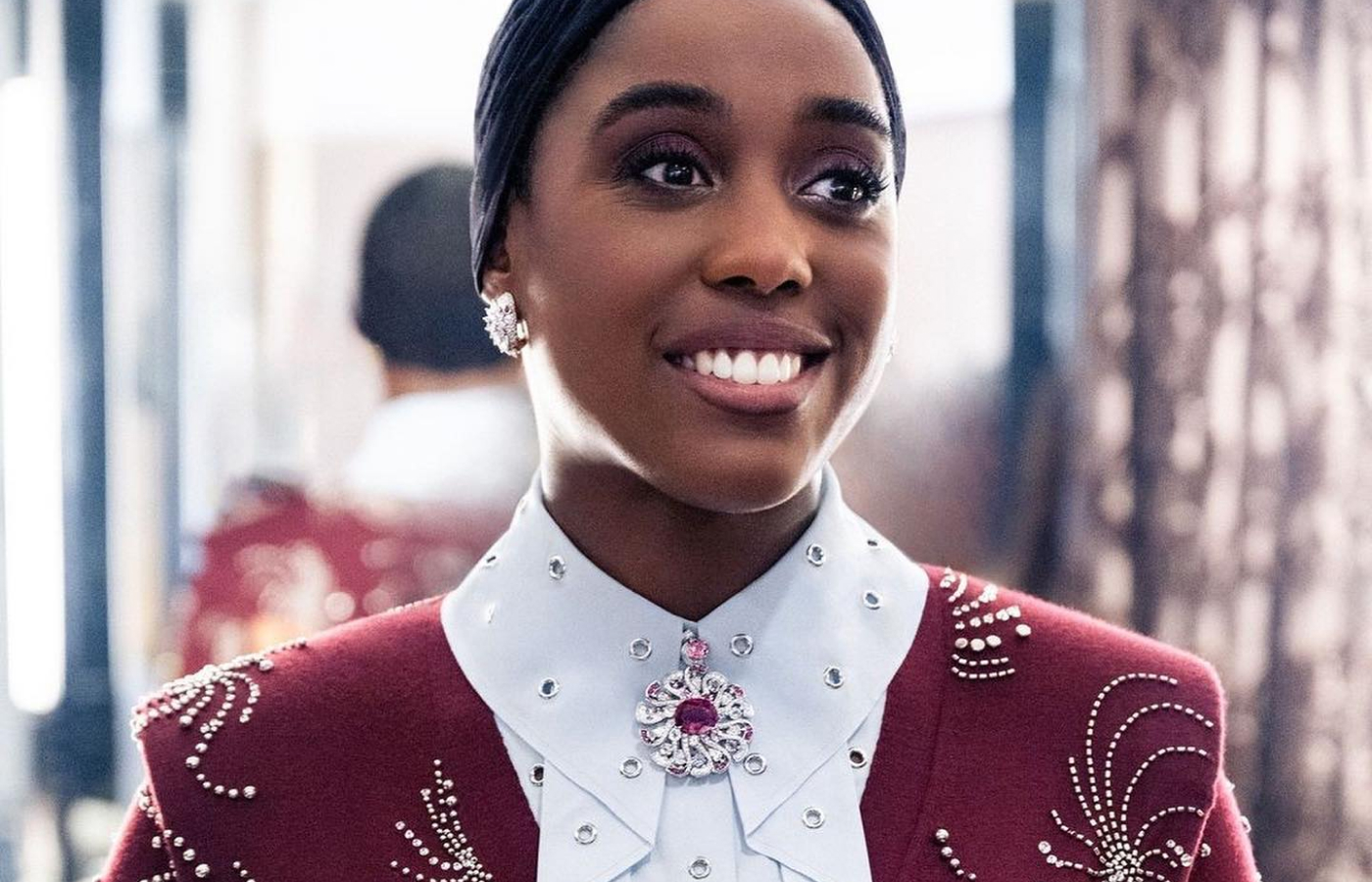  Lashana Lynch in a white gold, 13,16-ct rubellite, spinel, tourmaline and diamond necklace and gold, white gold and diamond Serpenti earrings, both by Bulgari