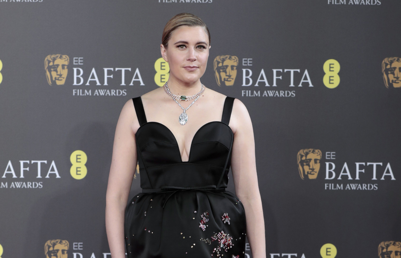  Greta Gerwig in a white gold, emerald and diamond Serpenti necklace and a pink gold, 22,86-ct tourmaline and diamond Divas' Dream necklace, both by Bulgari