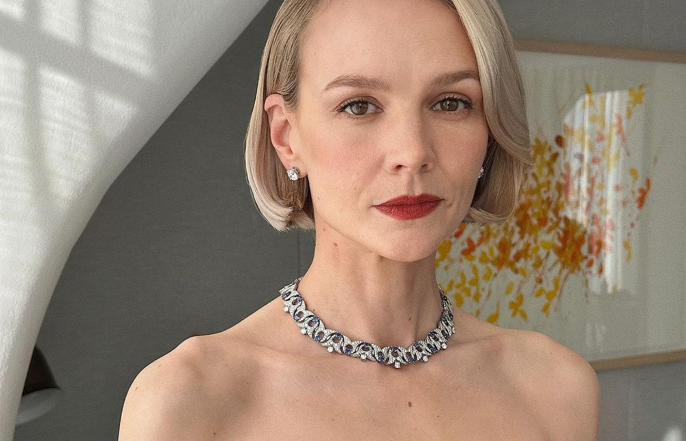 Carey Mulligan in a platinum, sapphire and diamond necklace and white gold and diamond earrings, both by Bulgari