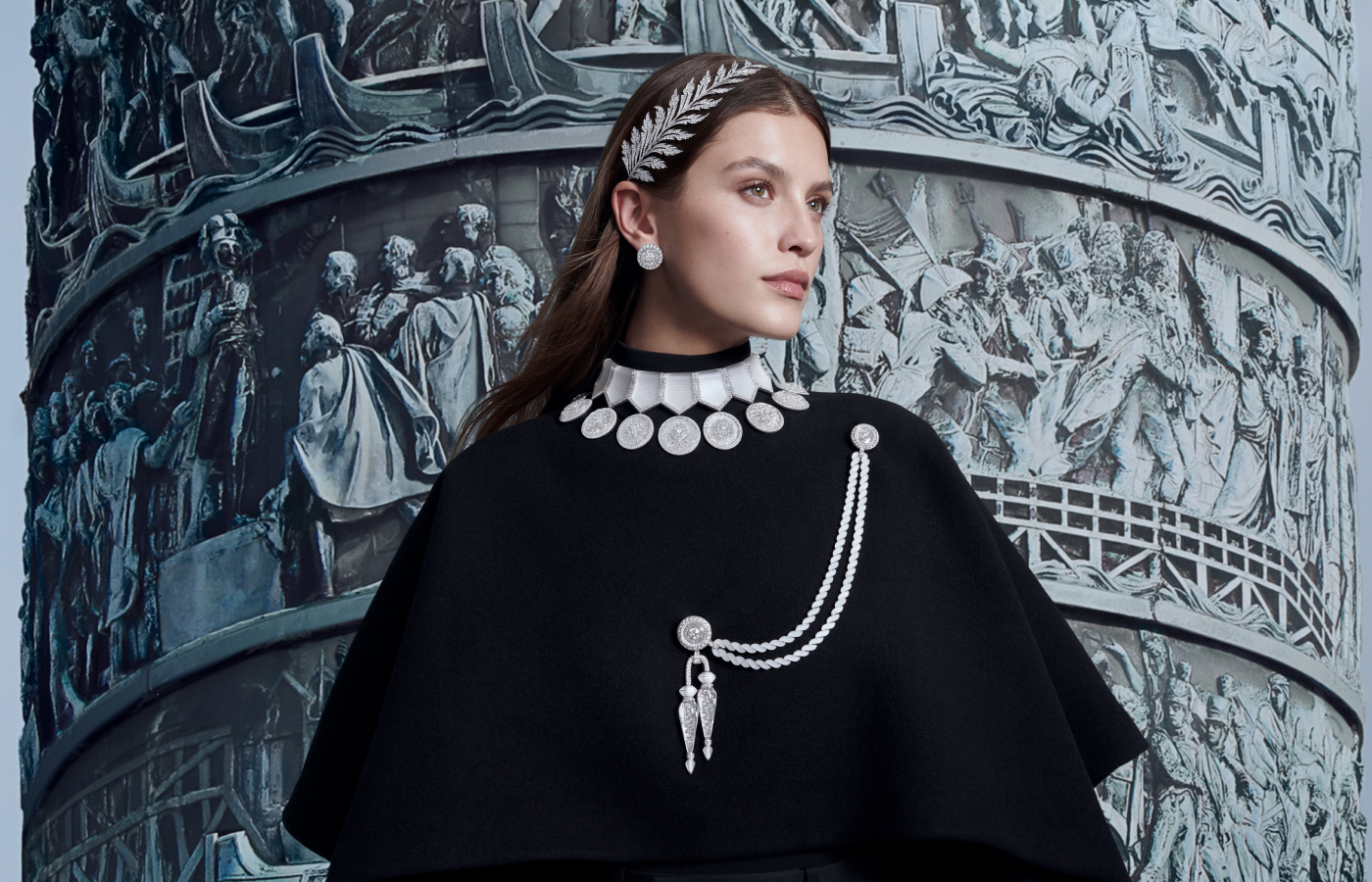 A model wears the Boucheron Broderies tiara, the Médailles pendant earrings and necklace, and the Aiguillette brooch, all in diamonds, rock crystal and 18k white gold, from the Histoire de Style The Power of Couture High Jewellery Collection