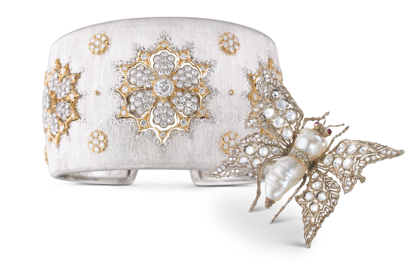 Buccellati High Jewellery Macri cuff bracelet in gold, white gold and diamond, alongside a Buccellati butterfly brooch in gold, silver, baroque pearl and diamond