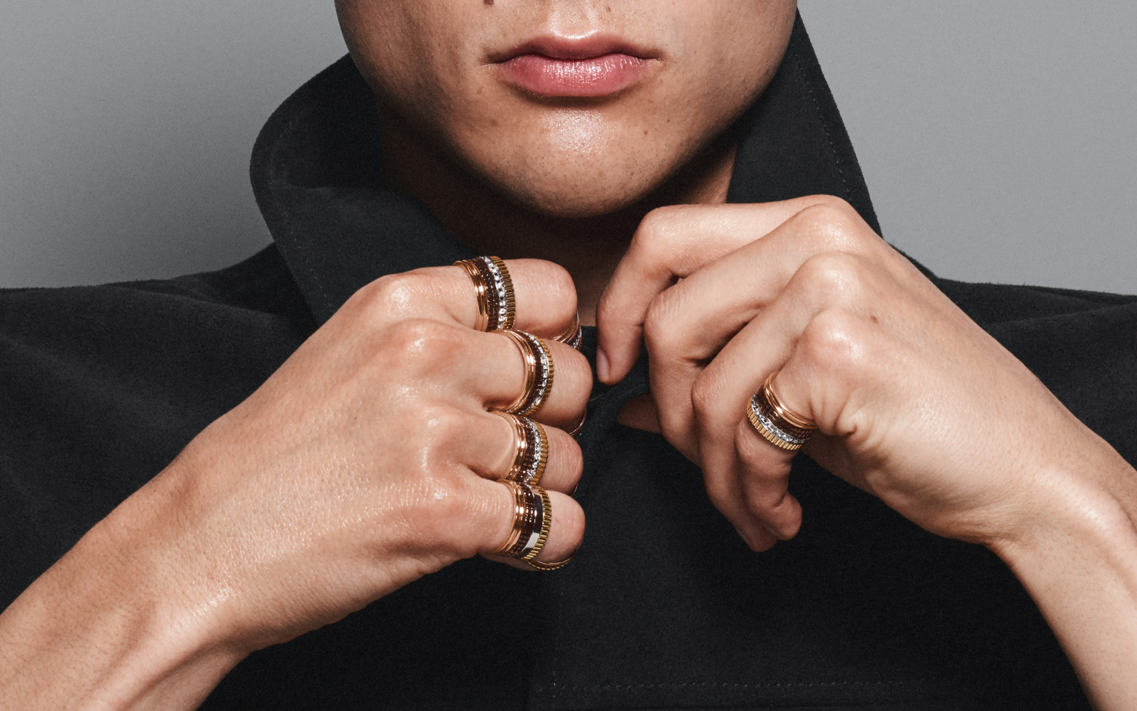 Model wearing the original Quatre ring design in gold, pink gold, white gold, enamel and diamond by Boucheron