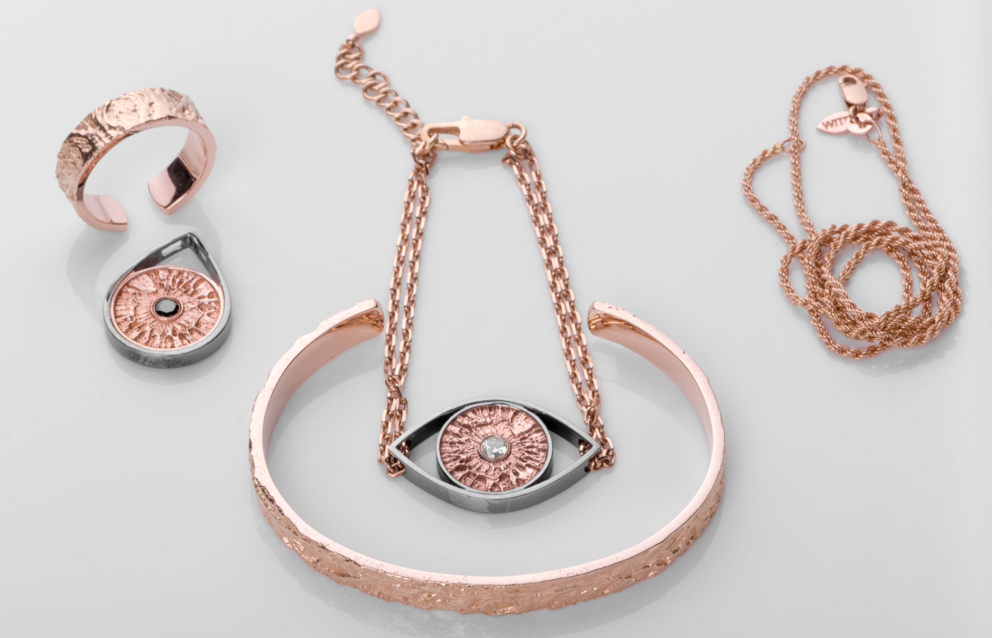  A selection of WITR fine jewellery pieces, including an iris print pendant and bracelet