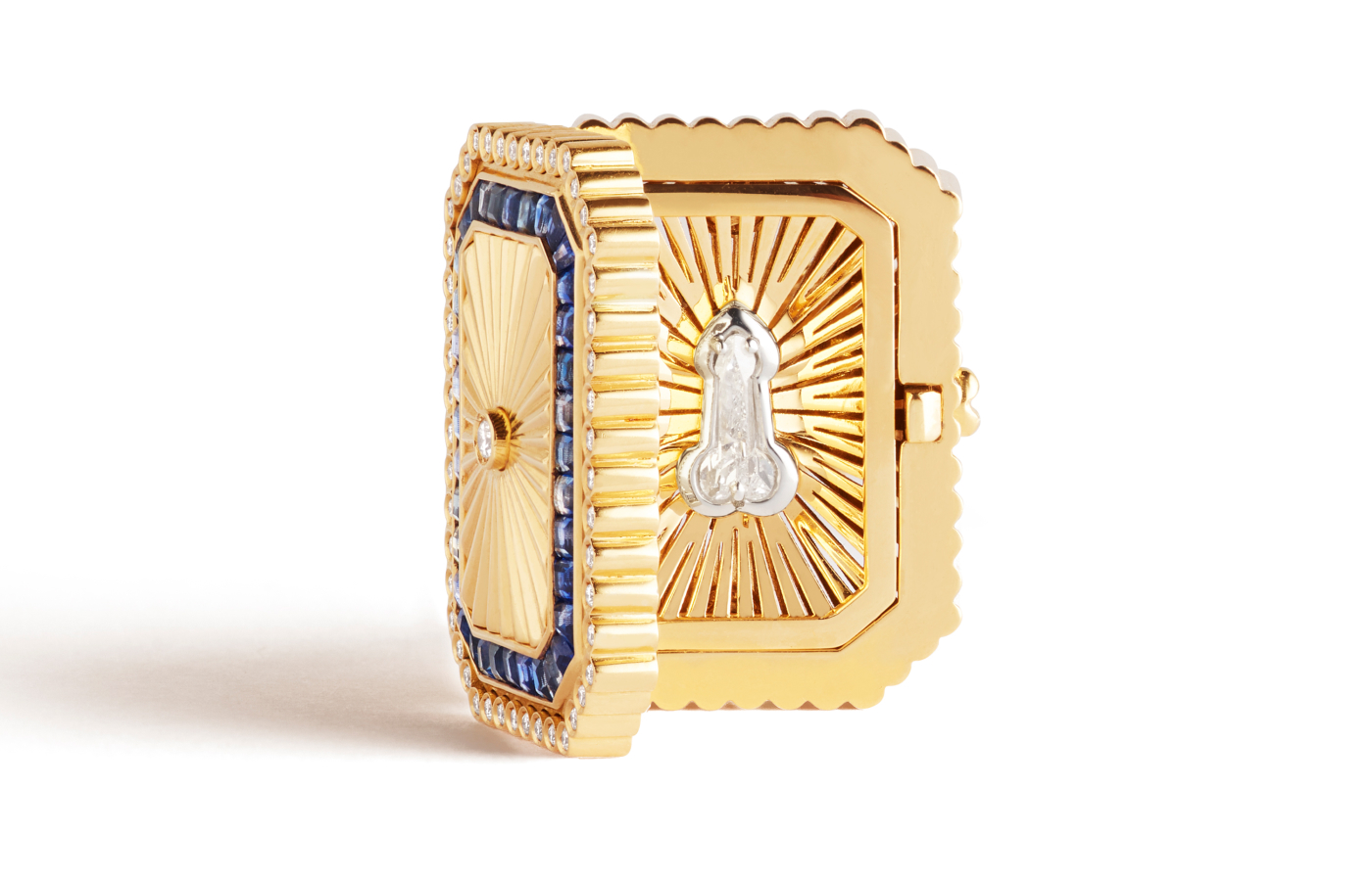 Open view of the Marie Lichtenberg Dick in a Box ring in gold, sapphire and diamond