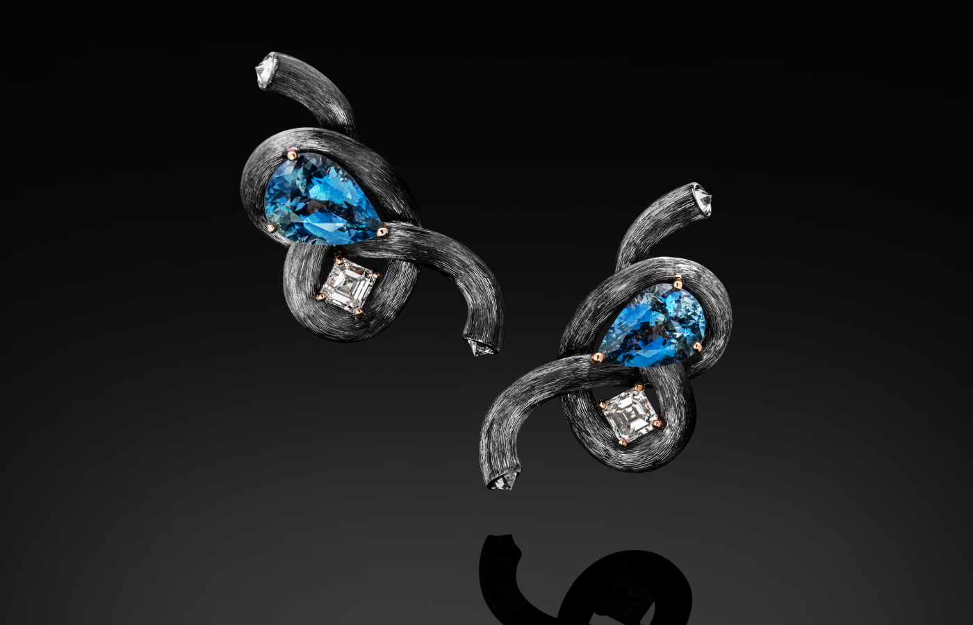  Austy Lee ‘The Silver Figure8 Knot’ earrings from The Lock-Knot collection in 18k white gold with Santa Maria deep blue aquamarine and white diamonds