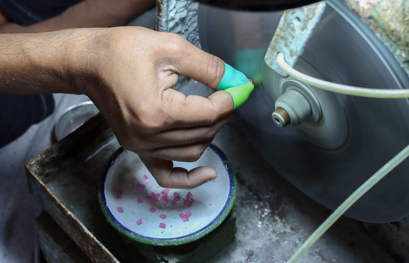  A specialist gem-cutter at Minehaus demonstrates the process of preforming to create a gemstone's all-important table facet