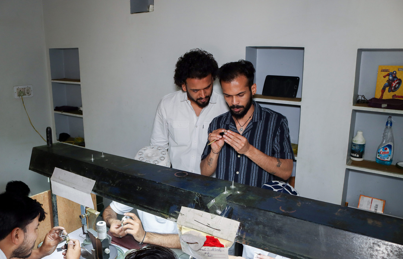 Minehaus directors Harsh and Shubham Chhabra sorting gemstones at their manufacturing facility in Jaipur, India