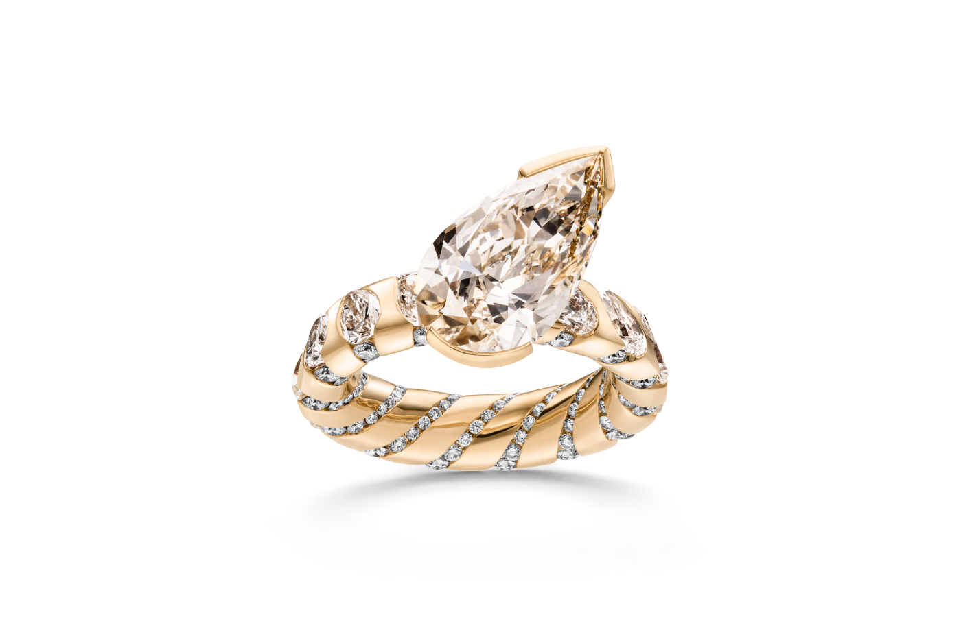 Schaffrath Paradoxal ring in 18k rose gold with a 6.24 carat pear-shaped pale brown diamond centre stone, 4.32 carats of pear-shaped very light brown diamonds, and a further 0.92 carats of round brilliant-cut diamonds 