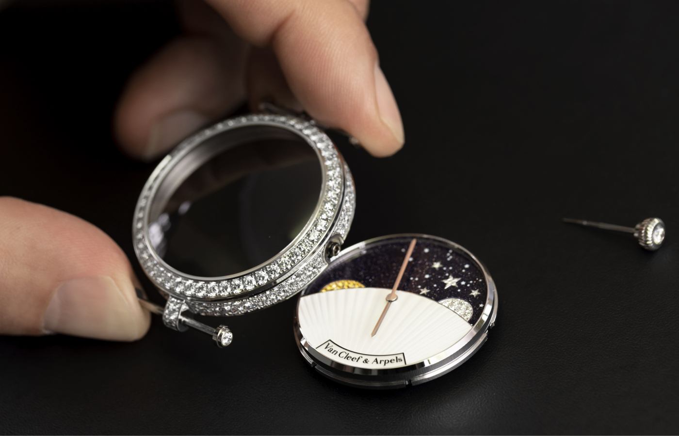  Crafting the Van Cleef & Arpels Lady Arpels Jour Nuit watch with a diamond-set 38mm case in white gold and a dial featuring mother-of-pearl, white and yellow gold, diamonds and yellow sapphires, to be showcased at the Poetry of Time exhibition in London