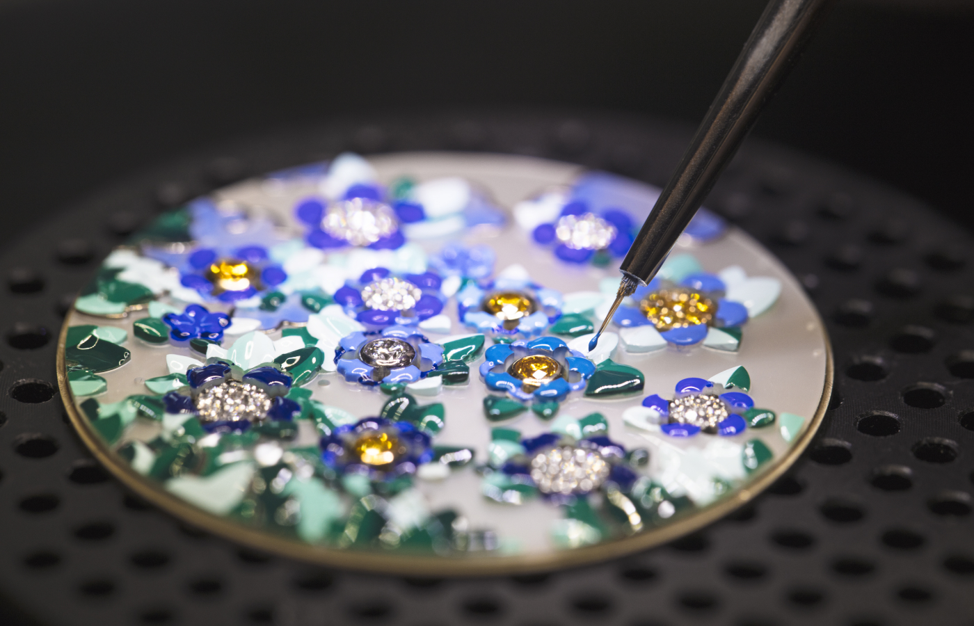  The colourful dial of the Van Cleef & Arpels Lady Arpels Heures Florales watch with white, yellow and rose gold, yellow and white diamonds, mother-of-pearl and miniature painting, to be showcased at the Poetry of Time exhibition in London