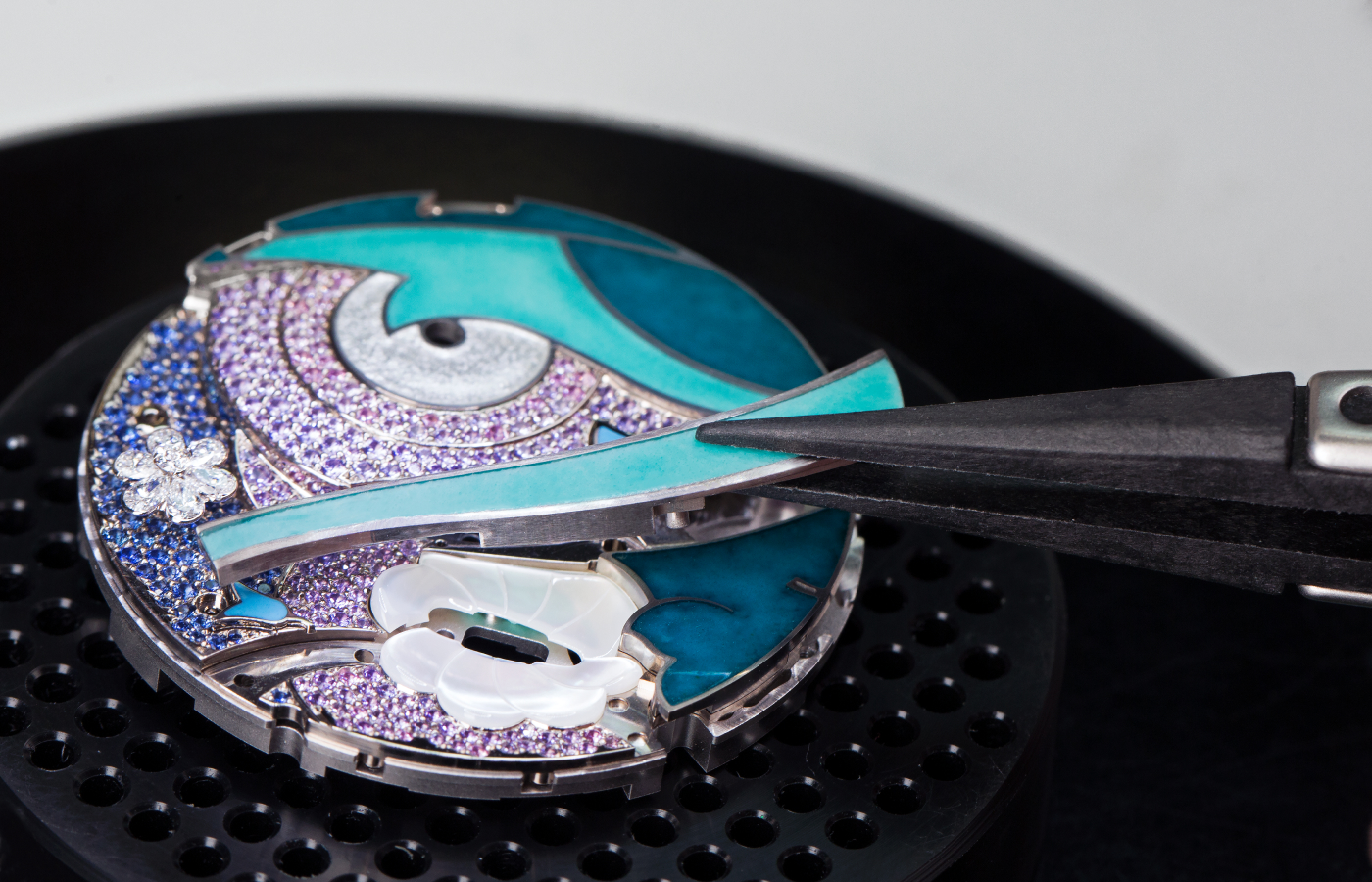  The Van Cleef & Arpels Lady Arpels Papillon Automate watch with a 40mm diamond-set case in white gold, featuring blue, mauve and purple sapphires, mother of pearl, champlevé, paillonné and plique-à-jour enamel, and miniature painting, to be showcased at the Poetry of Time exhibition in London
