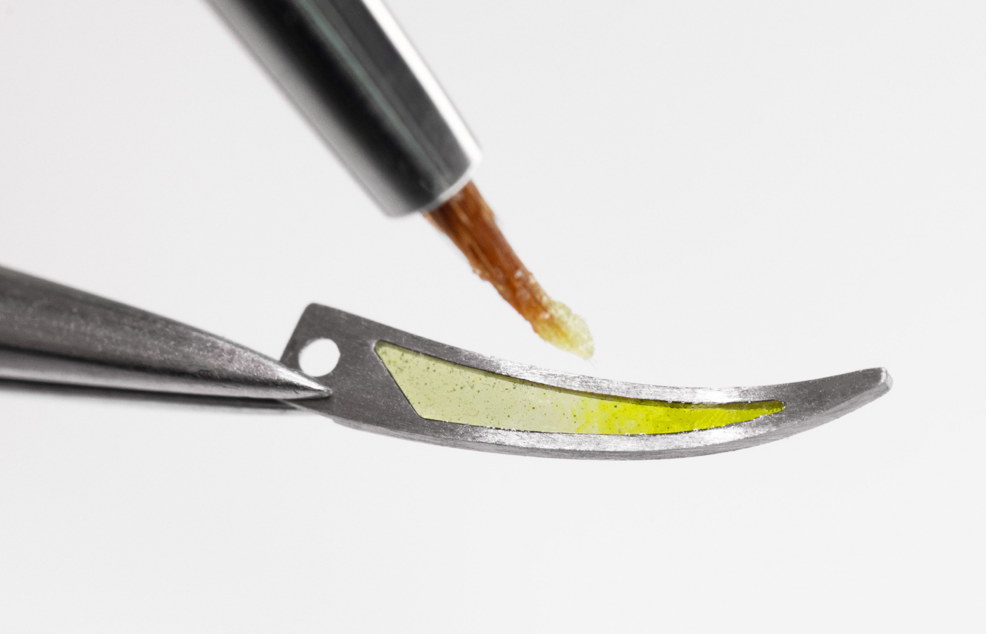  The process of hand-painting each element of the Van Cleef & Arpels Lady Arpels Brise d’Été watch with a 38mm diamond-set case in white gold, mother-of-pearl, tsavorite and spessartite garnets, and plique-à-jour, champlevé and vallonné enamel