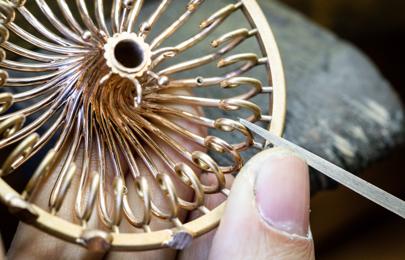  Preparing the golden framework for the Van Cleef & Arpels Lady Arpels Éveil du Cyclamen automaton, to be showcased at the Poetry of Time exhibition in London 