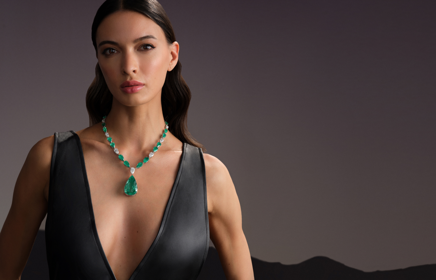 Hazoorilal Legacy necklace in white gold set with pear-shaped diamonds and natural Colombian emeralds, featuring a pear-shaped 88-ct emerald