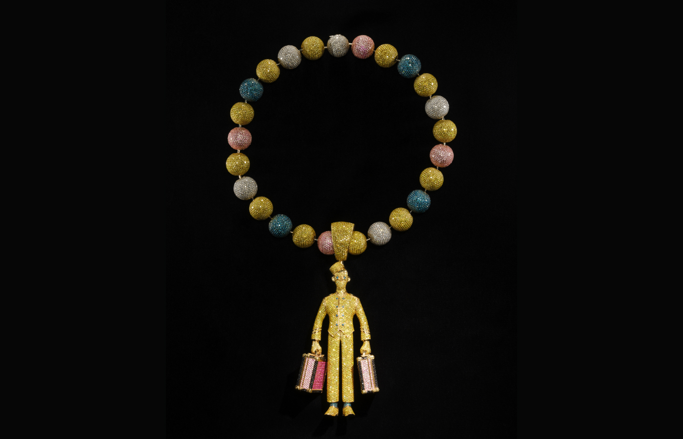  Designed by Alex Moss in 2021, the Bellhop necklace—inspired by Tyler, the Creator’s bellhop persona—features an operable briefcase and incorporates 186 carats of diamonds and 60 carats of sapphires as well as more than 23,000 hand-set stones. Alvaro Keding/© AMNH