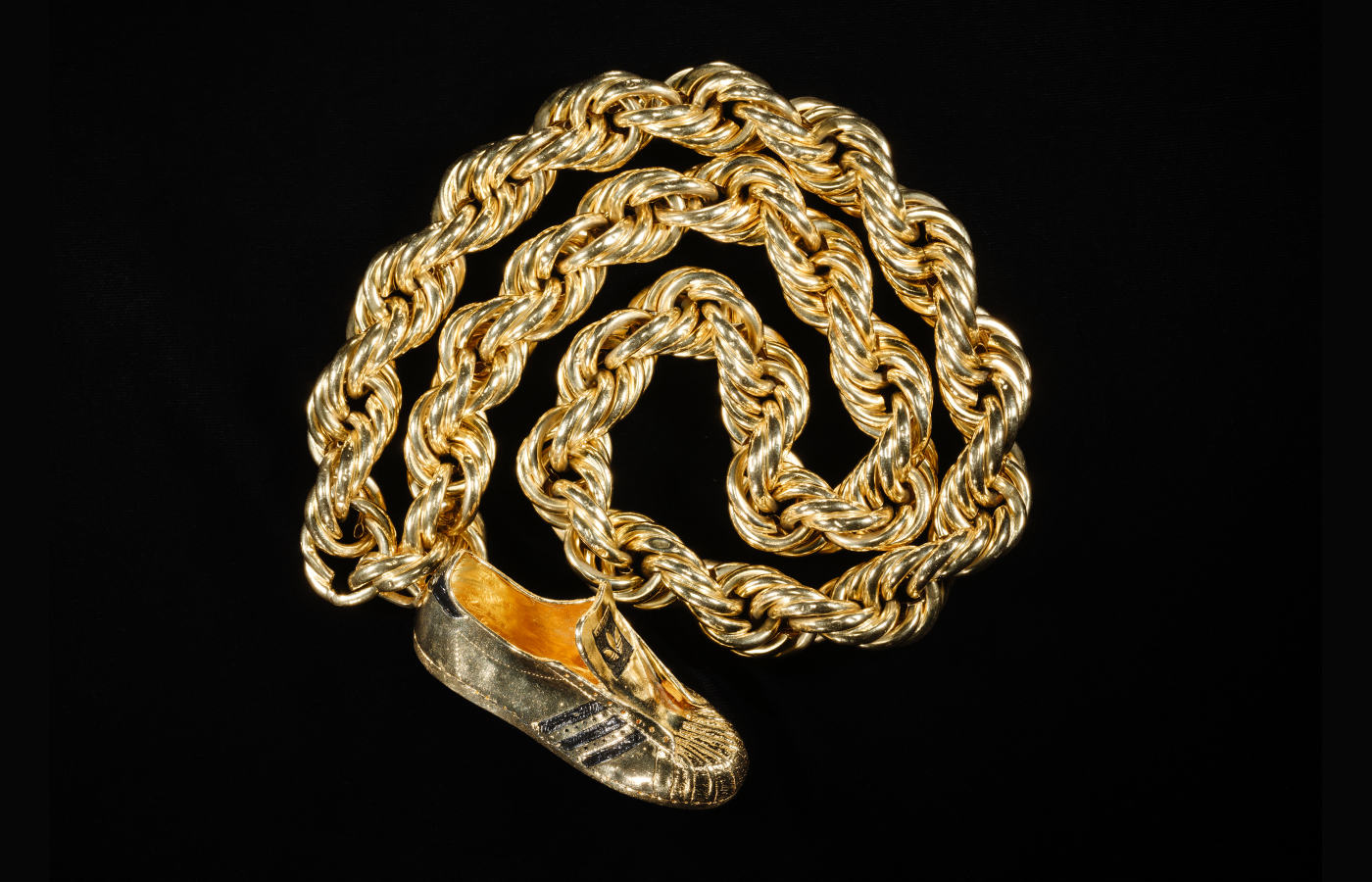 Following Run-DMC’s 1986 song “My Adidas,” Adidas struck a first-of-its-kind endorsement deal with the group, giving each member including Jam Master Jay one of these 14-karat gold sneaker-shaped pendants. Alvaro Keding/© AMNH