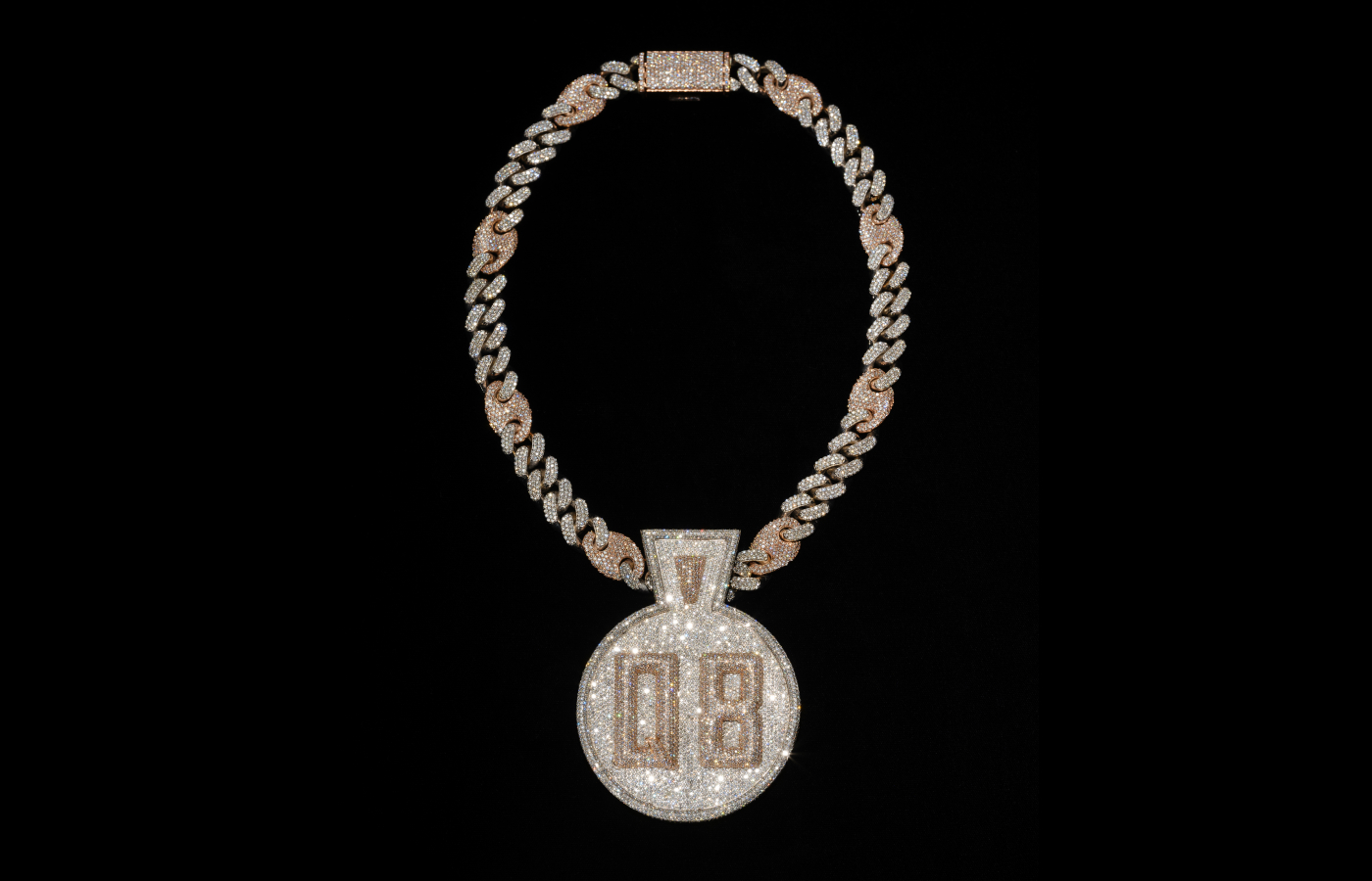  Featuring white and rose gold, this custom diamond-encrusted Queensbridge pendant was commissioned from Pristine Jewelers by Nas in 2018 to commemorate Queensbridge Houses in Queens, New York, where he grew up. Alvaro Keding/© AMNH