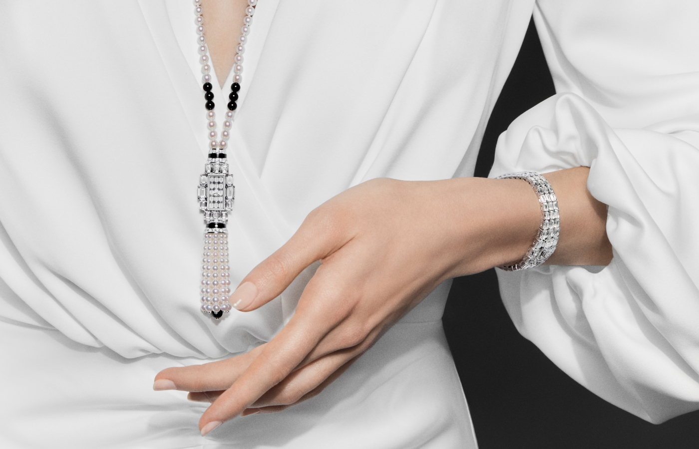 Model wearing the Vacheron Constantin Grand Lady Kalla High Jewellery watch in white gold, onyx beads, akoya beads and diamond